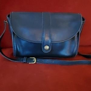 Coach purse...maybe an antique. Definitely vintage